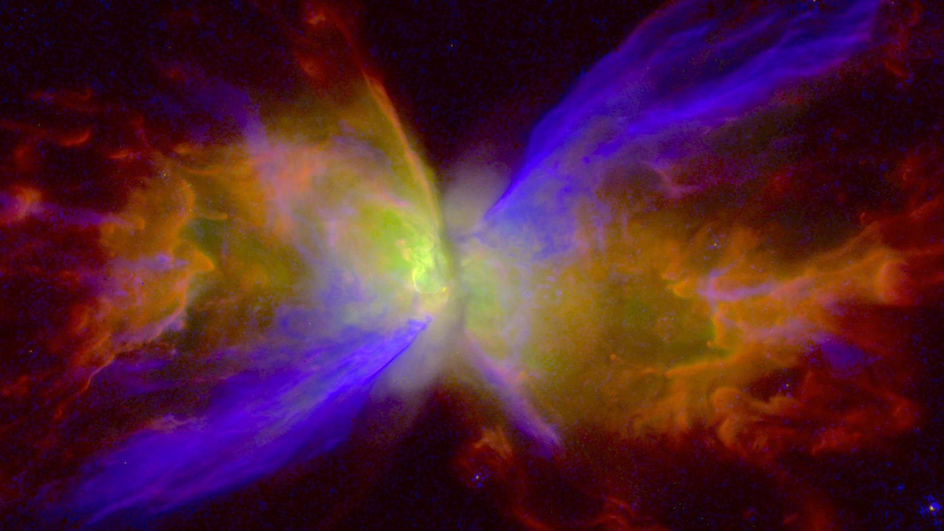 Ein sanduhrförmiger, farbiger Nebel um ein leuchtendes Zentrum vor dunklem Hintergrund.