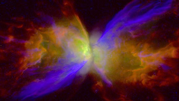 Ein sanduhrförmiger, farbiger Nebel um ein leuchtendes Zentrum vor dunklem Hintergrund.