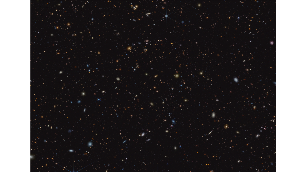 Ein dunkler Hintergrund voll leuchtender verschwommener Flecken in verschiedenen blassen Farbtönen