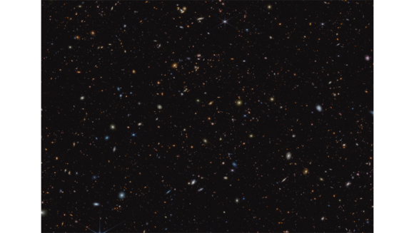 Ein dunkler Hintergrund voll leuchtender verschwommener Flecken in verschiedenen blassen Farbtönen