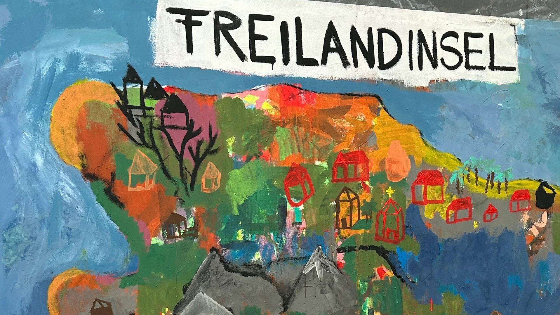 Foto einer Leinwand, darauf ist eine gemalte Insel.