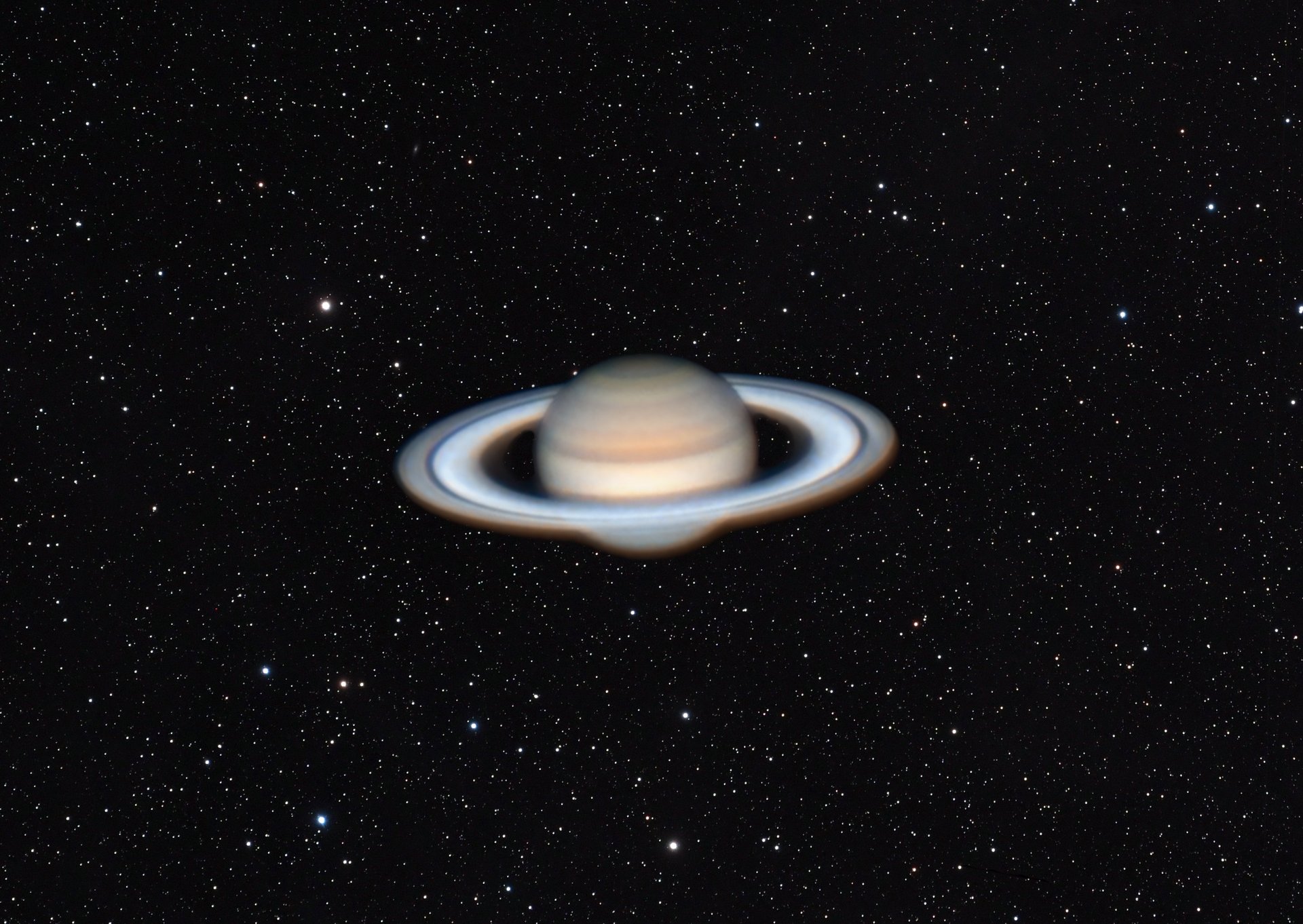 Der Planet Saturn umgeben von Sternen