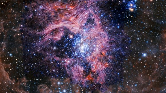 Eine Wolke aus blauen und rötlichen Sternen, darübergelegt ein Netz aus feinen Linien, die den Verlauf des Magnetfelds zeigen.