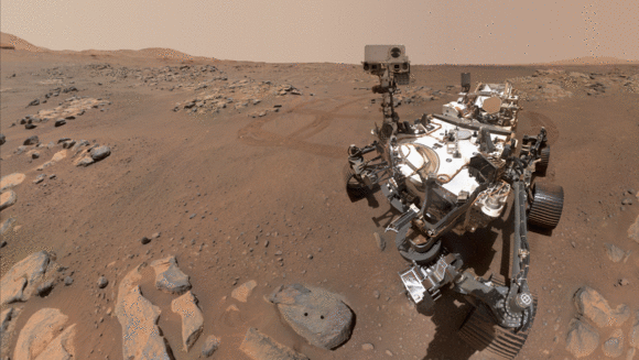 Ein Rover vor einer Marslandschaft